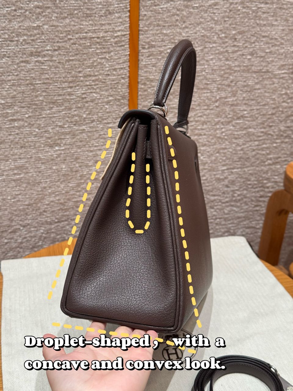 Brown custom leather top-handle bag, side profile